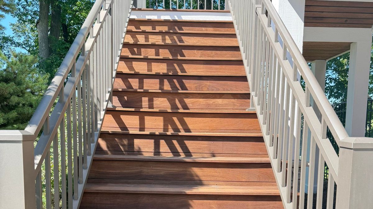 Refinished cedar deck staircase and railing in Wayzata, MN